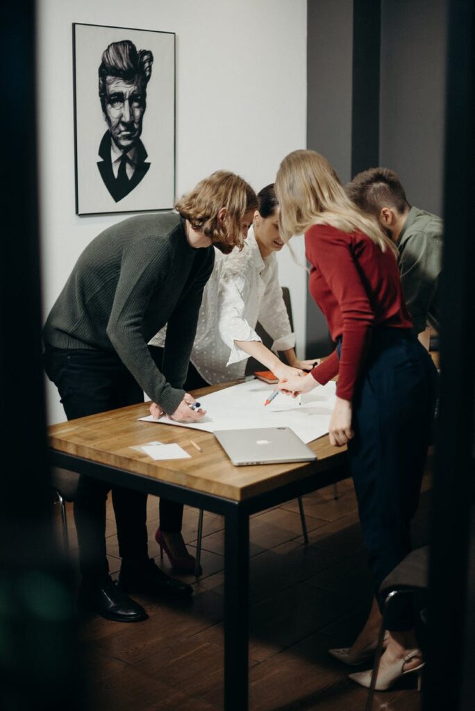 women and men standing near table